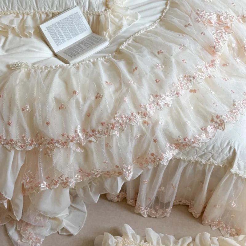 White ruffle duvet cover with tiered ivory lace panels and softly embroidered floral details – L&B