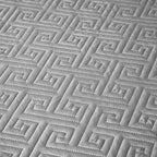 Close-up of silver gray geometric quilted bedspread texture from LUSTRA SILVER – L&B