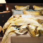 Detailed view of white and gold marble bedding with a fluid jacquard pattern and richly draped duvet corner – L&B