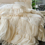 Close view of ivory ruffled lace duvet cover with graceful floor-length draping, RUBYLACE IVORY – L&B