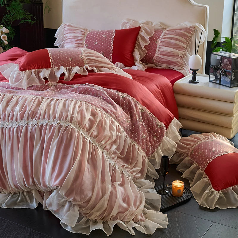 Red and white ruffled lace duvet cover layered with matching princess pillow shams, RUBYLACE RED – L&B