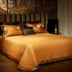Textured burnt orange quilted bedspread styled with coordinating baroque pillow shams – ROYAL H. ORANGE – L&B