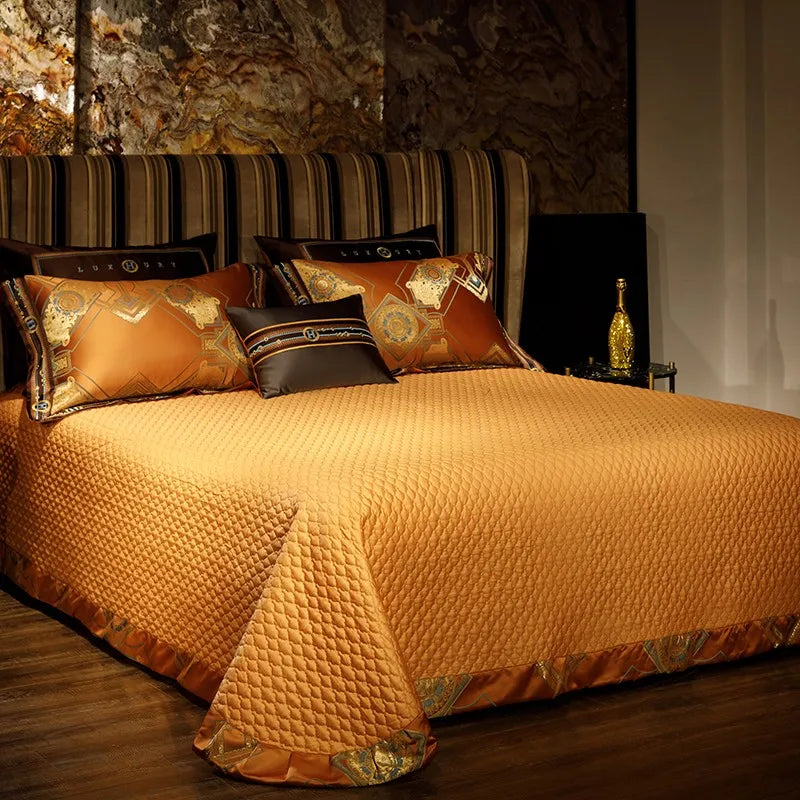 Textured burnt orange quilted bedspread styled with coordinating baroque pillow shams – ROYAL H. ORANGE – L&B