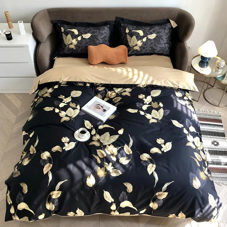 Black and gold botanical duvet cover set with golden leaf pattern in a modern bedroom – L&B