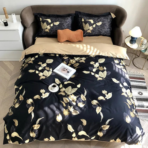 Black and gold botanical duvet cover set with golden leaf pattern in a modern bedroom – L&B
