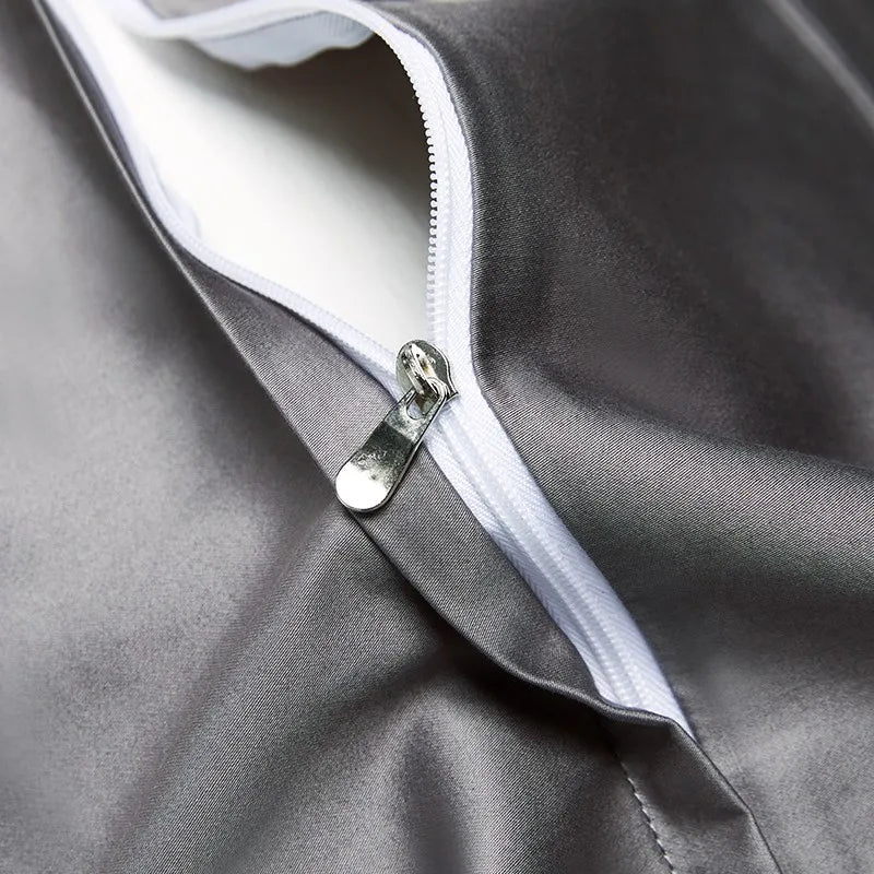 Close-up of the concealed zipper closure on the smooth charcoal-gray Egyptian cotton reverse of the duvet cover – L&B