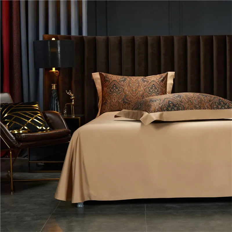 Beige bedspread styled with brown paisley pillow shams, ZUVRIC – L&B