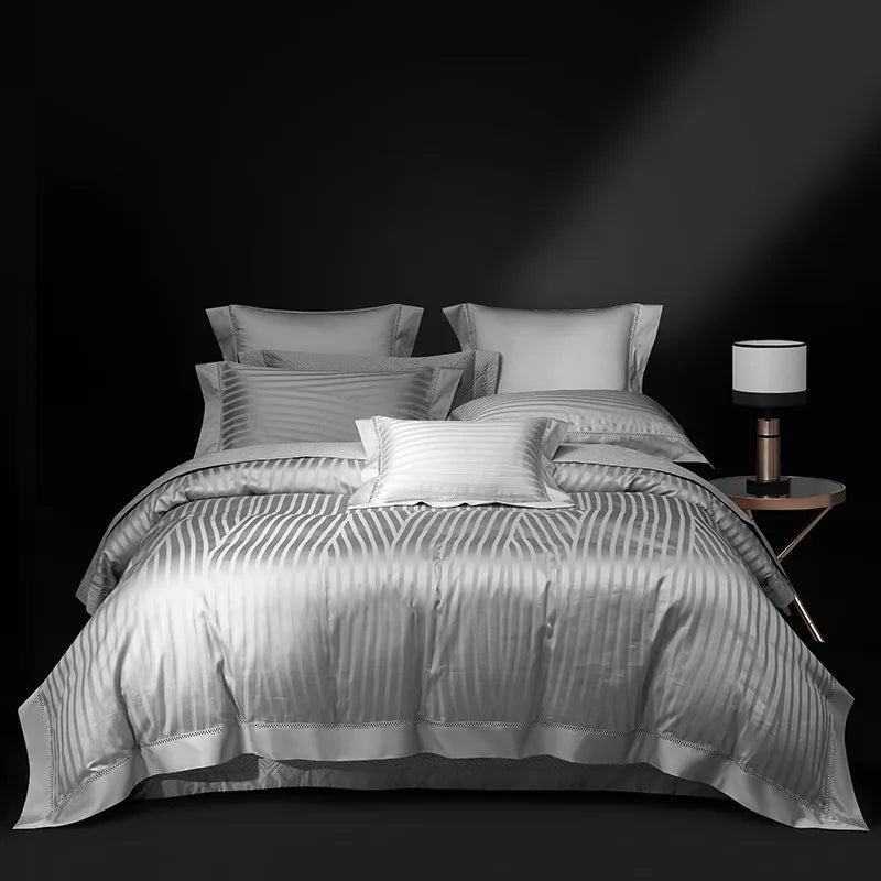 Silver gray striped duvet cover and quilted bedspread set styled in a tailored bedroom, LUSTRA SILVER – L&B