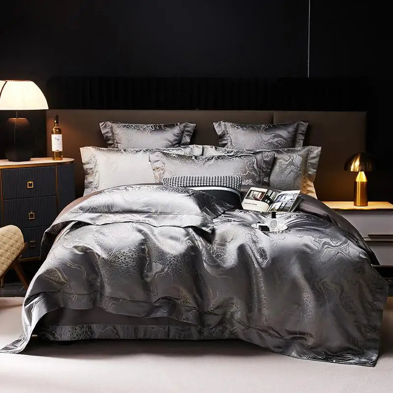 Charcoal gray jacquard duvet cover set with matching shams and layered pillows in a modern luxury bedroom – L&B