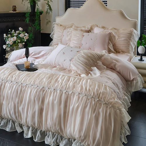 Blush pink ruffle duvet cover with romantic lace and embroidered pillows, angled view of RUBYLACE BLUSH – L&B