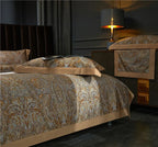 Side view of gold and pale blue baroque duvet cover set in a dark bedroom, ZLIKAN – L&B
