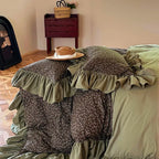 Reversible olive green floral-to-solid duvet cover layered with romantic ruffle trim, MOSSBELLE – L&B