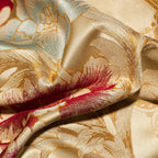 Close-up of 600TC Egyptian cotton satin with dimensional red floral embroidery and woven gold jacquard details – L&B