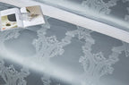 Close-up of light blue Egyptian cotton satin fabric with a smooth drape and serene luminous sheen – L&B