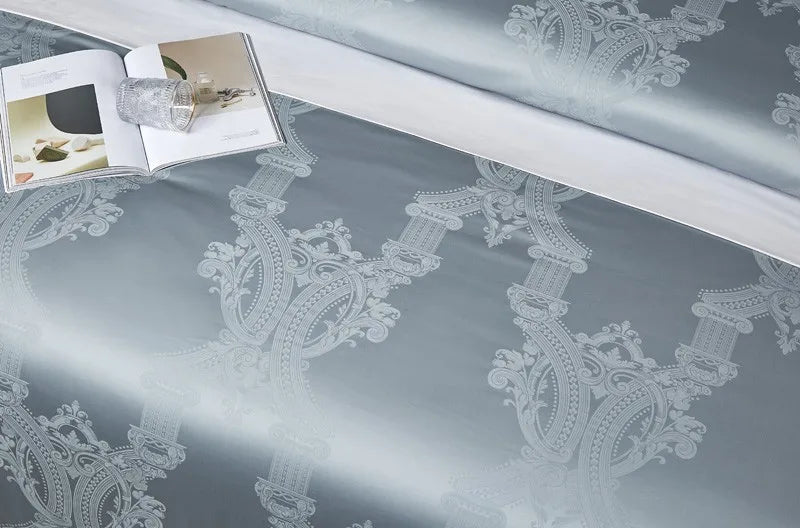 Close-up of light blue Egyptian cotton satin fabric with a smooth drape and serene luminous sheen – L&B