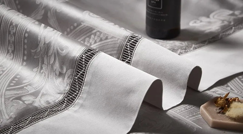 Close-up of same-tone braided trim and piping on the silver gray Egyptian cotton satin duvet cover – L&B