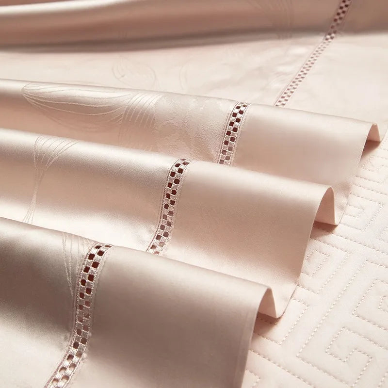 Close-up of blush pink long-staple cotton bedding with delicate openwork edge trim, LUSTRA BLUSH – L&B