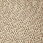 Close-up of champagne gold geometric quilted bedspread texture from LUSTRA GOLD – L&B