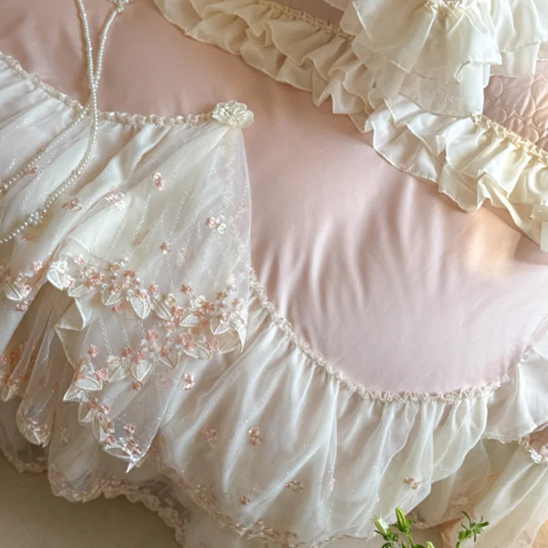 Pink ruffle duvet cover with delicate floral embroidery, ivory lace panels, and layered scalloped trim – L&B
