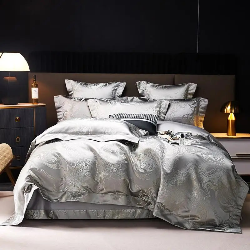 Silver gray jacquard duvet cover set with matching shams and layered pillows in a sophisticated modern bedroom – L&B