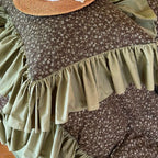 Close-up of wide olive green gathered ruffles framing the ditsy floral duvet cover, MOSSBELLE – L&B