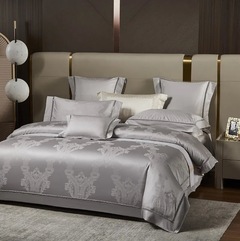 Luxury silver gray bedding set styled with a damask jacquard duvet cover and coordinating decorative pillows – L&B