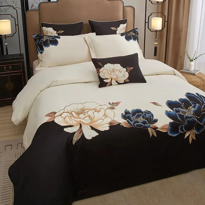 Luxury black floral bedding with large blue and ivory peony embroidery across a smooth Egyptian cotton duvet cover – L&B