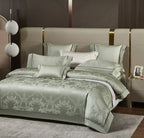 Luxury sage green bedding set styled with a damask jacquard duvet cover and coordinating decorative pillows – L&B