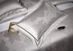 Silver grey damask decorative pillow with an architectural jacquard pattern and refined tonal edging – L&B