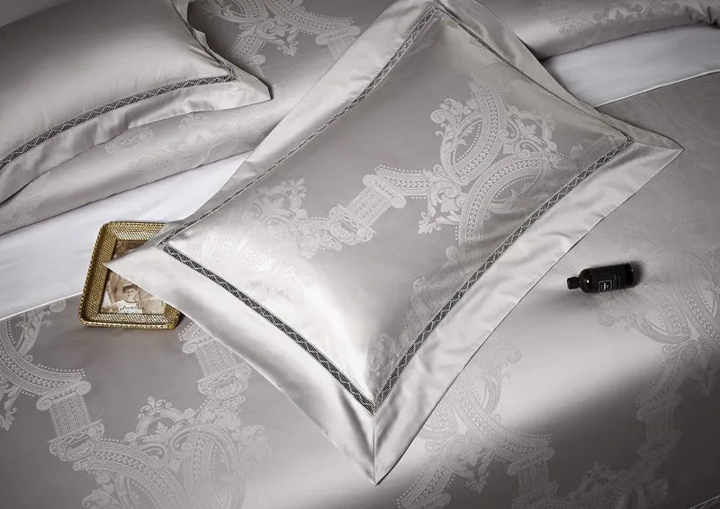 Silver grey damask decorative pillow with an architectural jacquard pattern and refined tonal edging – L&B