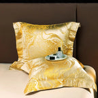 Gold satin jacquard pillow sham and matching duvet cover displayed with an elegant fluid marble pattern – L&B