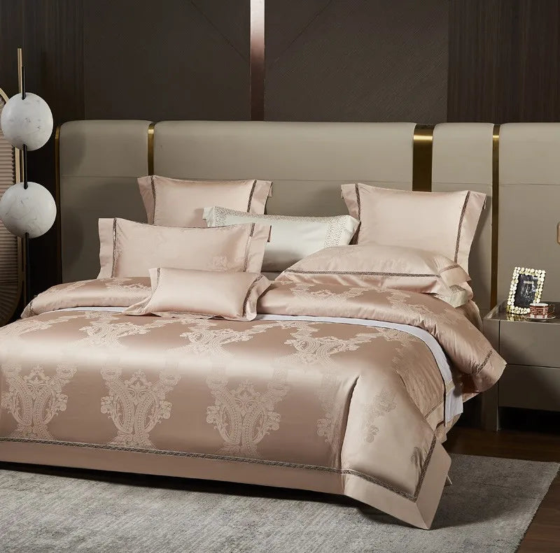 Luxury beige bedding set styled with a champagne damask duvet cover and coordinating decorative pillows - L&B