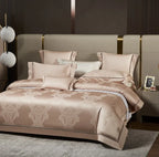 Luxury beige bedding set styled with a champagne damask duvet cover and coordinating decorative pillows - L&B