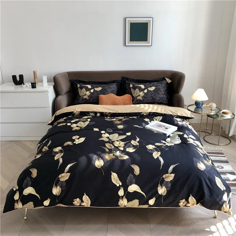 Black botanical bedding set with gold leaves and matching pillow shams, front view – L&B