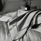 Pewter gray abstract geometric duvet cover layered with coordinating pillows and bedspread, LUSTRA PEWTER – L&B