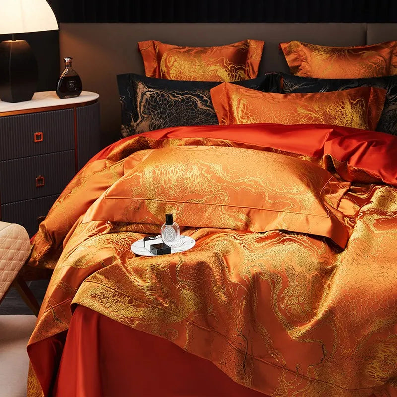 Burnt orange duvet cover set styled on a modern bed with matching jacquard shams and contrasting deep red sheets – L&B