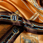 Close-up of dark braided trim with jewel-inspired accents on burnt orange satin bedding – ROYAL H. ORANGE – L&B