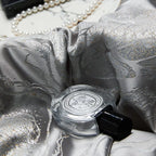 Detailed view of silver jacquard bedding highlighting the intricate dragon and cloud motif and reflective platinum sheen – L&B