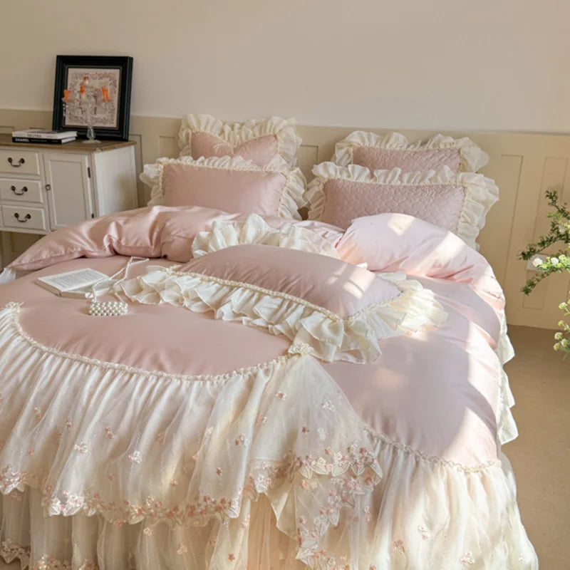 Pink cottagecore bedding with a blush heart-quilted duvet cover, ivory lace ruffles, and floral embroidery – L&B