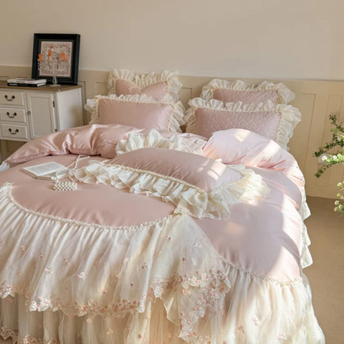 Pink cottagecore bedding with a blush heart-quilted duvet cover, ivory lace ruffles, and floral embroidery – L&B
