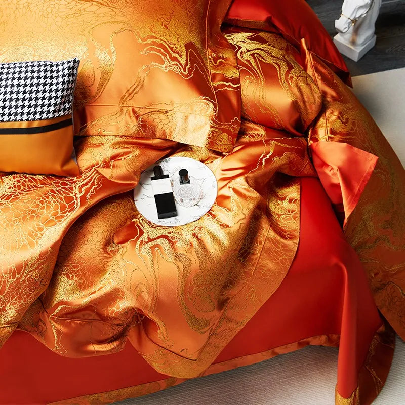 Detailed view of luxury burnt orange bedding showing the soft drape, intricate jacquard pattern, and copper sheen – L&B