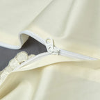 Close-up of the concealed zipper closure on the ivory and gray embroidered duvet cover – L&B