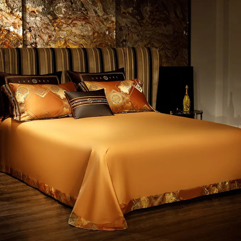 Solid burnt orange flat sheet with a smooth satin finish and coordinating decorative pillows – ROYAL H. ORANGE – L&B