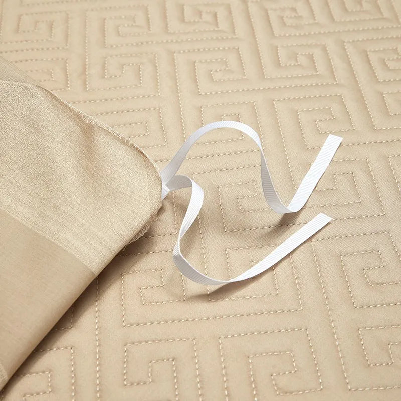 Champagne gold quilted bedspread with dimensional geometric stitching and refined finishing, LUSTRA GOLD – L&B