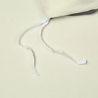 Interior corner ties on the ivory duvet cover designed to help secure the duvet insert in place – L&B