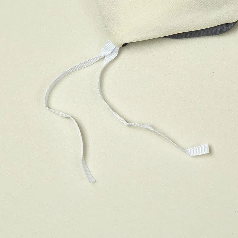Interior corner ties on the ivory duvet cover designed to help secure the duvet insert in place – L&B