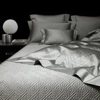 Pewter gray geometric duvet cover layered with coordinating pillows and bedspread, LUSTRA PEWTER – L&B