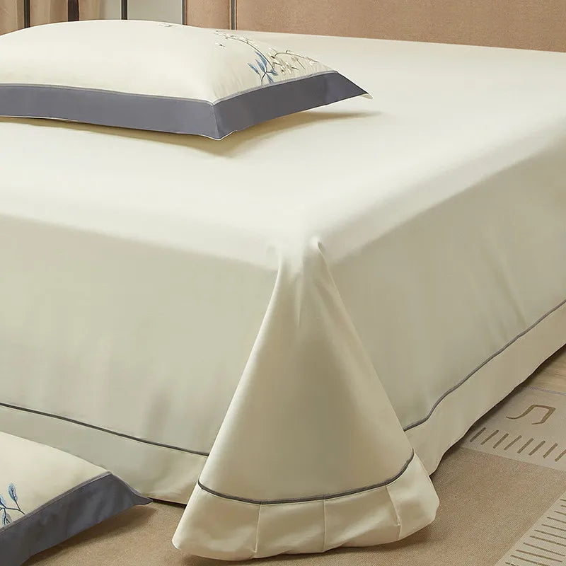 Ivory Egyptian cotton flat sheet with a smooth drape, tailored hem, and softly ruffled edge – L&B