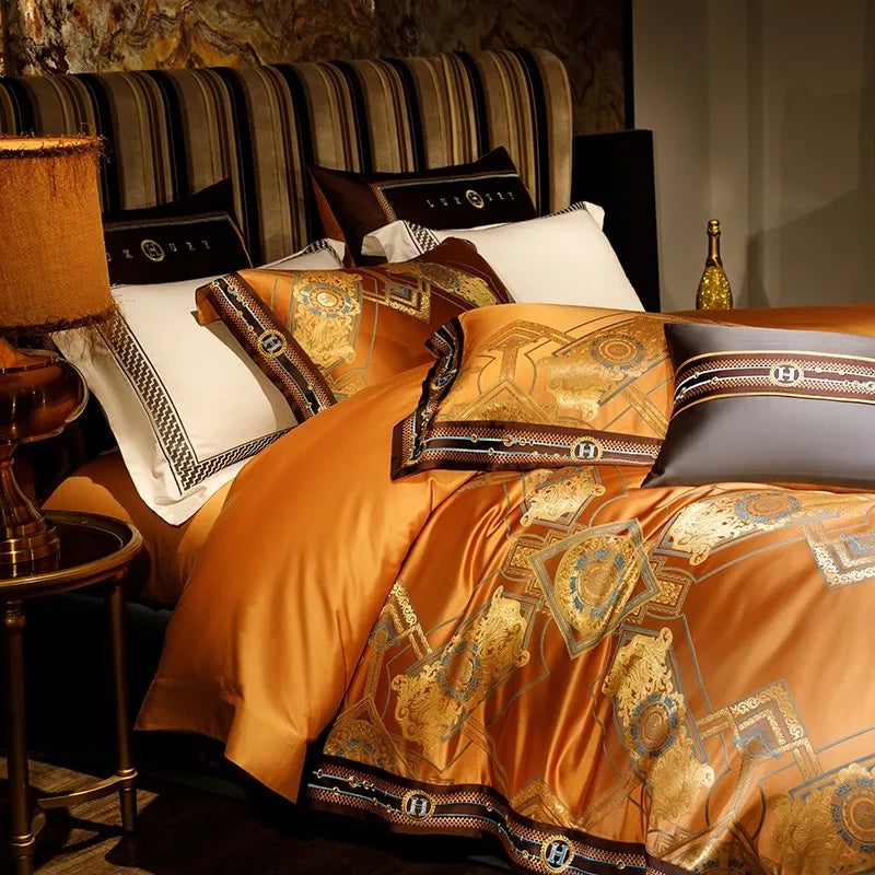 Burnt orange Egyptian cotton bedding draped to display its gold jacquard pattern and fluid satin finish – ROYAL H. ORANGE – L&B