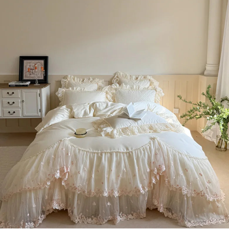 Ivory cottagecore bedding with a heart-quilted cotton duvet cover, tiered lace ruffles, and delicate floral embroidery – L&B